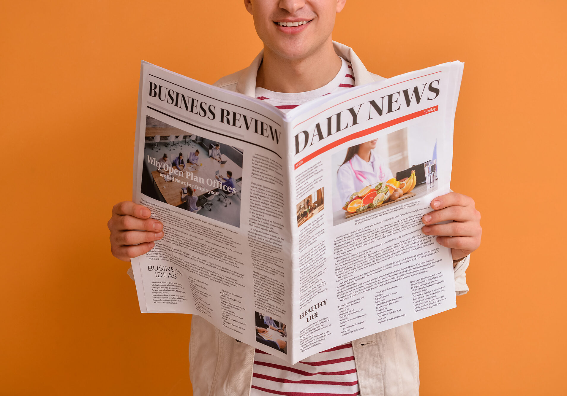 Young man reading newspaper on color background